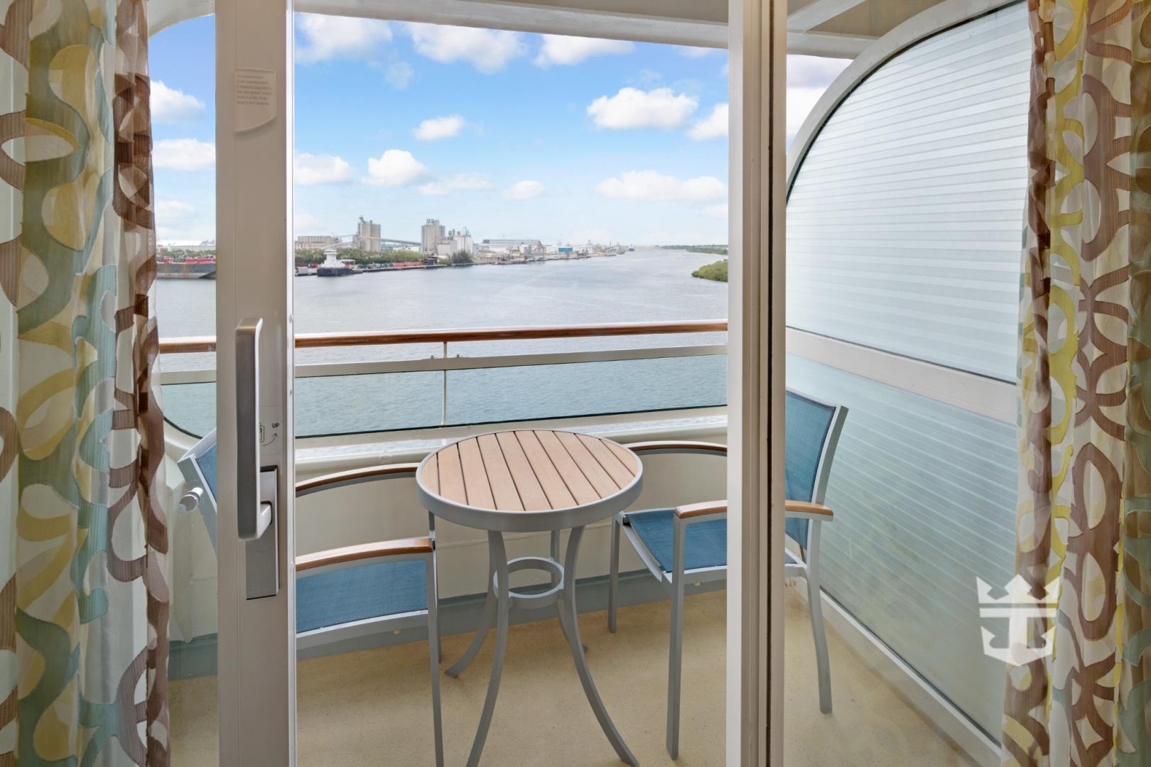 View of seating on a Superior Ocean View stateroom balcony